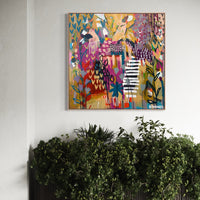 Abstract colorful painting on a wall above a radiator with plants.